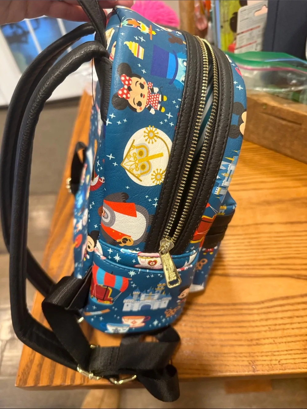 Loungefly Blue Mini Backpack with Colorful Theme Park Character Print